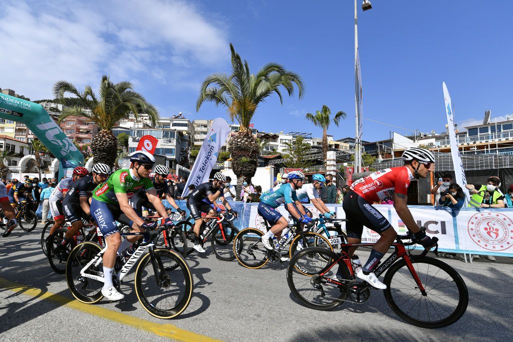KEMER TURKEY APRIL 14 Start Jasper Philipsen of Belgium and Team AlpecinFenix Green Points Jersey Vitaliy Buts of Ukraine and Salcano Sakarya BB Cycling Team Red Mountain Jersey Mark Cavendish of United Kingdom and Team Deceuninck QuickStep Turquoise Leader Jersey Artyom Zakharov of Kazahkstan and Team Astana Premier Tech White Beauties of Turkey Jersey during the 56th Presidential Cycling Tour Of Turkey 2021 Stage 4 a 1844km stage from Alanya to Kemer Oakley Sunglasses TUR2021 tourofturkeyTUR on April 14 2021 in Kemer Turkey Photo by Stuart FranklinGetty Images