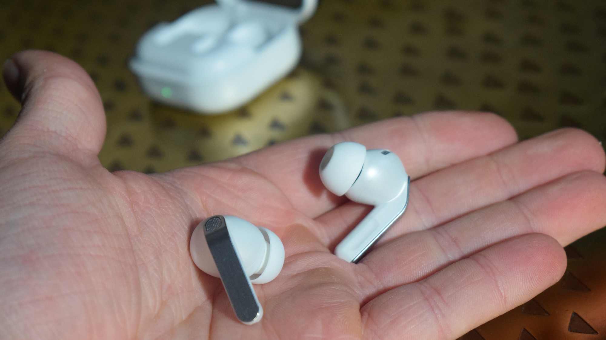 Both Samsung Galaxy Buds 4 Pro in a man's hand.