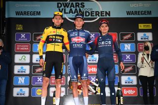 WAREGEM BELGIUM MARCH 30 LR Tiesj Benoot of Belgium and Team Jumbo Visma on second place race winner Mathieu Van Der Poel of Netherlands and Team AlpecinFenix and Thomas Pidcock of United Kingdom and Team INEOS Grenadiers on third place pose on the podium ceremony after the 76th Dwars Door Vlaanderen 2022 Mens Elite a 1837km one day race from Roeselare to Waregem DDV22 DDVmen WorldTour on March 30 2022 in Waregem Belgium Photo by Tim de WaeleGetty Images