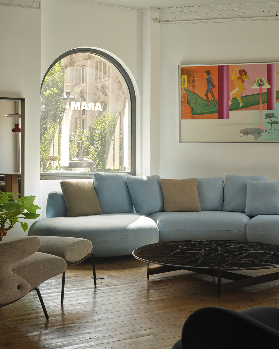 a light blue sofa in a showroom