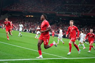 Denmark's defender #05 Patrick Dorgu (C) celebrates scoring the 1-0 opening goal during the UEFA Nations League football match League A, Group A4, Day 1, Denmark v Switzerland in the Parken stadium in Copenhagen, Denmark, on September 5, 2024. (Photo by Mads Claus Rasmussen / Ritzau Scanpix / AFP) / Denmark OUT (Photo by MADS CLAUS RASMUSSEN/Ritzau Scanpix/AFP via Getty Images) Tottenham Hotspur target