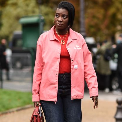 Nikki Ogunnaike wearing a pink jacket and jeans 