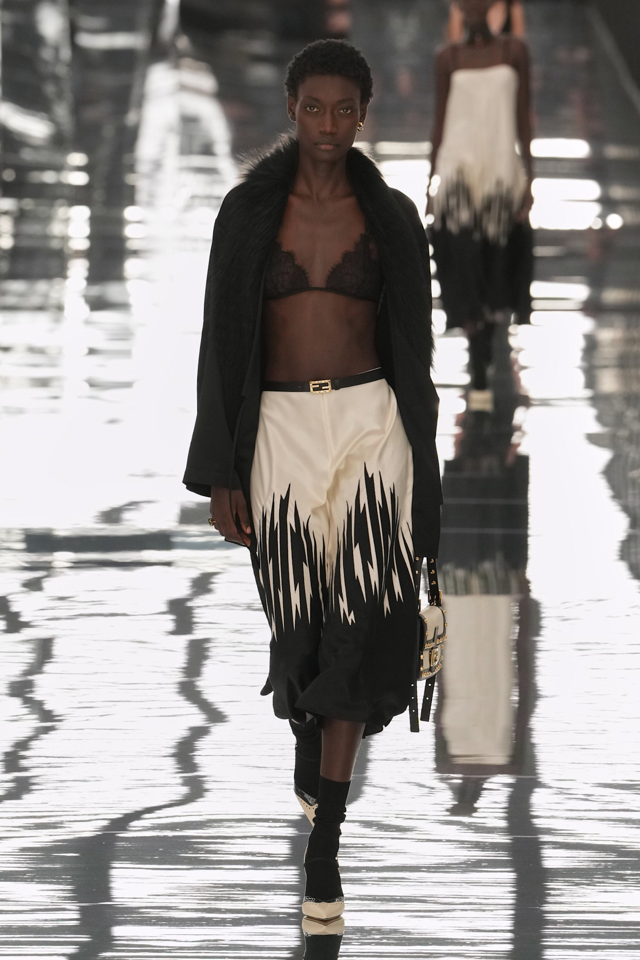 Photos of models walking down the runway at the Fendi Spring Summer 2027 show during Milan Fashion Week