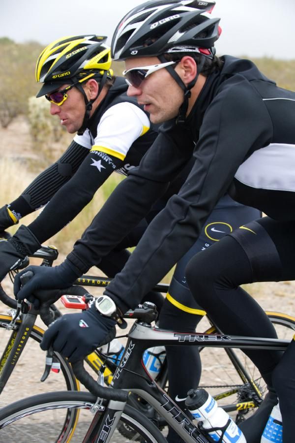 Lance Armstrong and Gert Steegmans ride side-by-side.