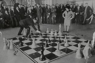  Nona Gaprindashvili of the Soviet Union, pictured playing a game of chess at the International Chess Congress in London on 30th December 1964.