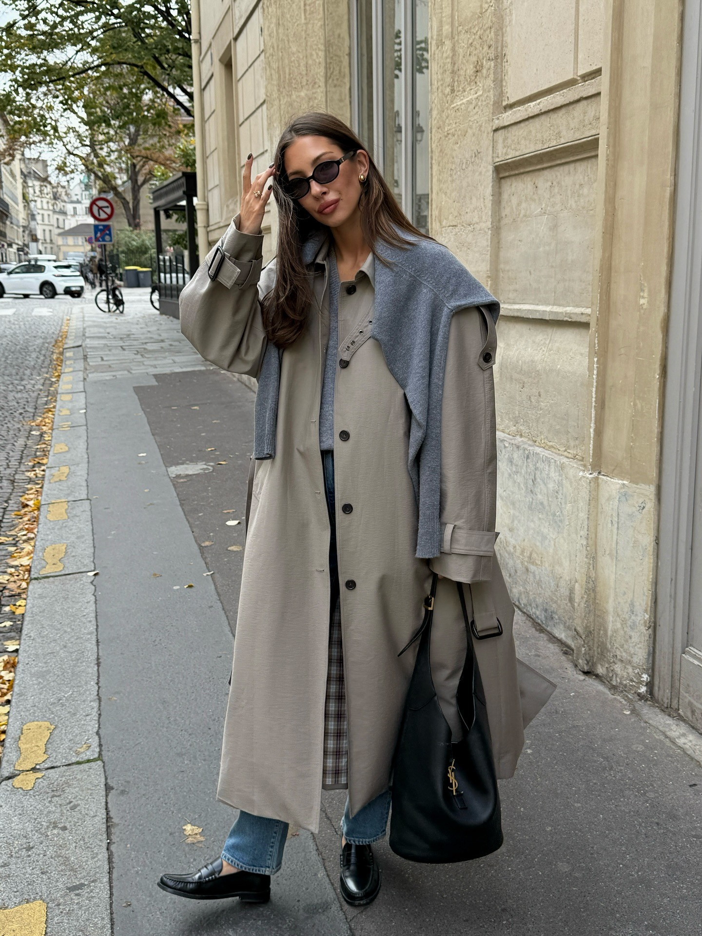 The Paris outfit featuring stylish jeans, a trench coat, and a blazer