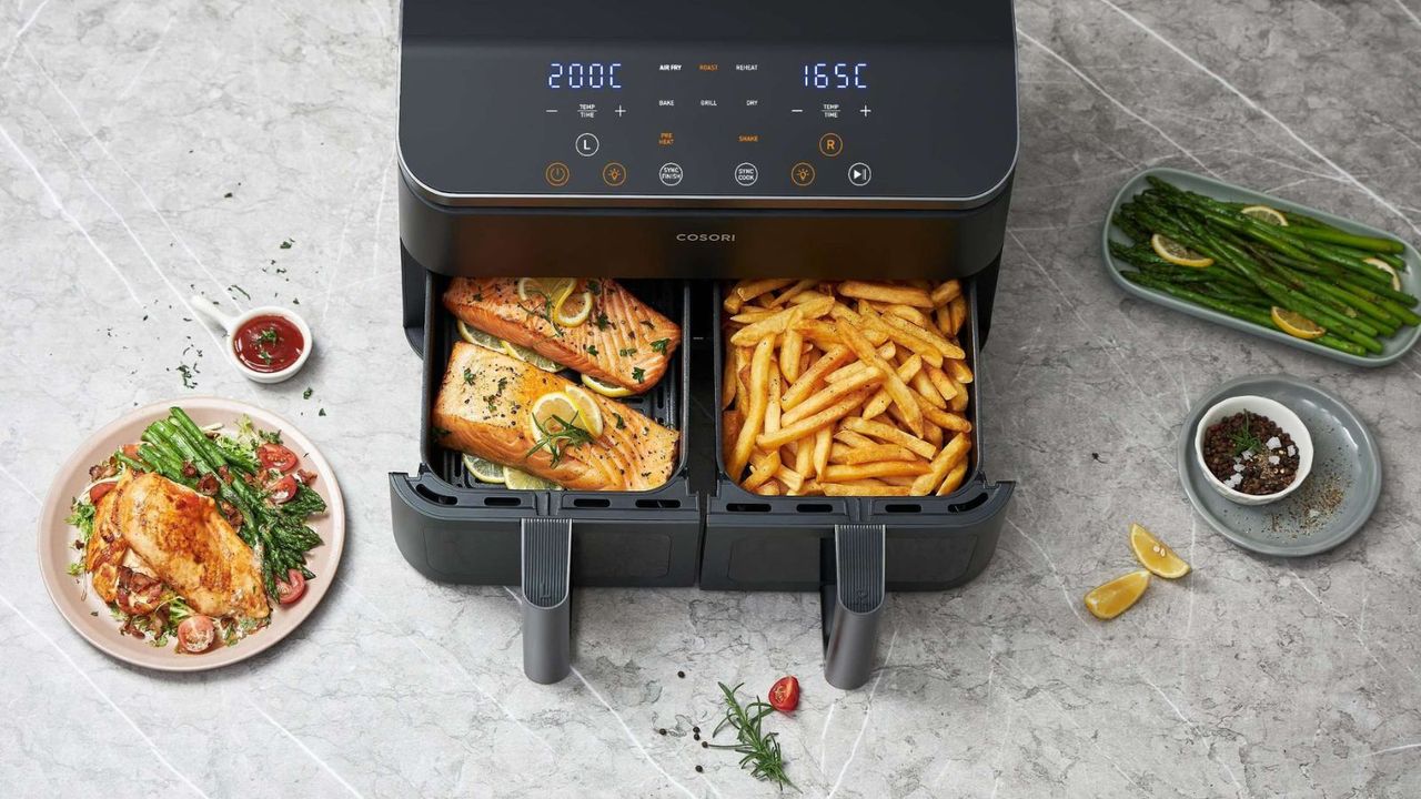 Cosori Dual Drawer Air Fryer bird&#039;s eye view with fries in one basket and salmon in another