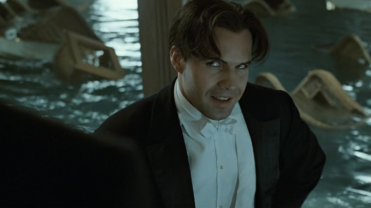 Cal looking annoyed in a tuxedo in Titanic