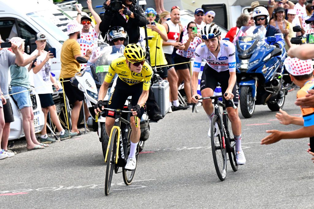 MORZINE LES PORTES DU SOLEIL FRANCE JULY 15 LR Jonas Vingegaard of Denmark and Team JumboVisma Yellow leader jersey and Tadej Pogacar of Slovenia and UAE Team Emirates White best young jersey compete in the breakaway while fans cheers during the stage fourteen of the 110th Tour de France 2023 a 1518km stage from Annemasse to Morzine les Portes du Soleil UCIWT on July 15 2023 in Morzine les Portes du Soleil France Photo by Bernard Papon PoolGetty Images