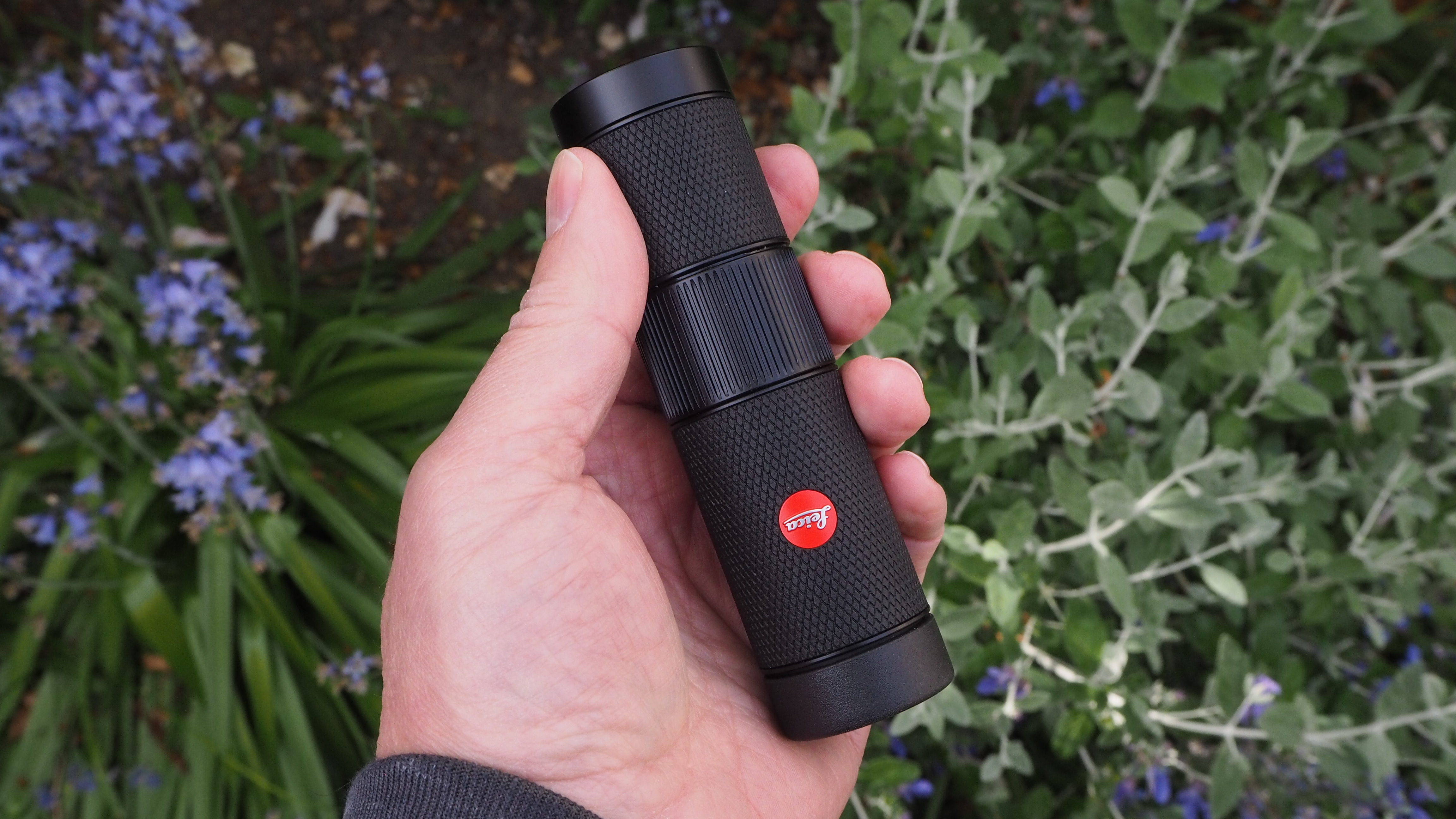 Leica Monovid 8x25 monocular held in someone's hand