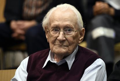 A German court sentenced former SS officer Oskar Groening to 4 years in prison