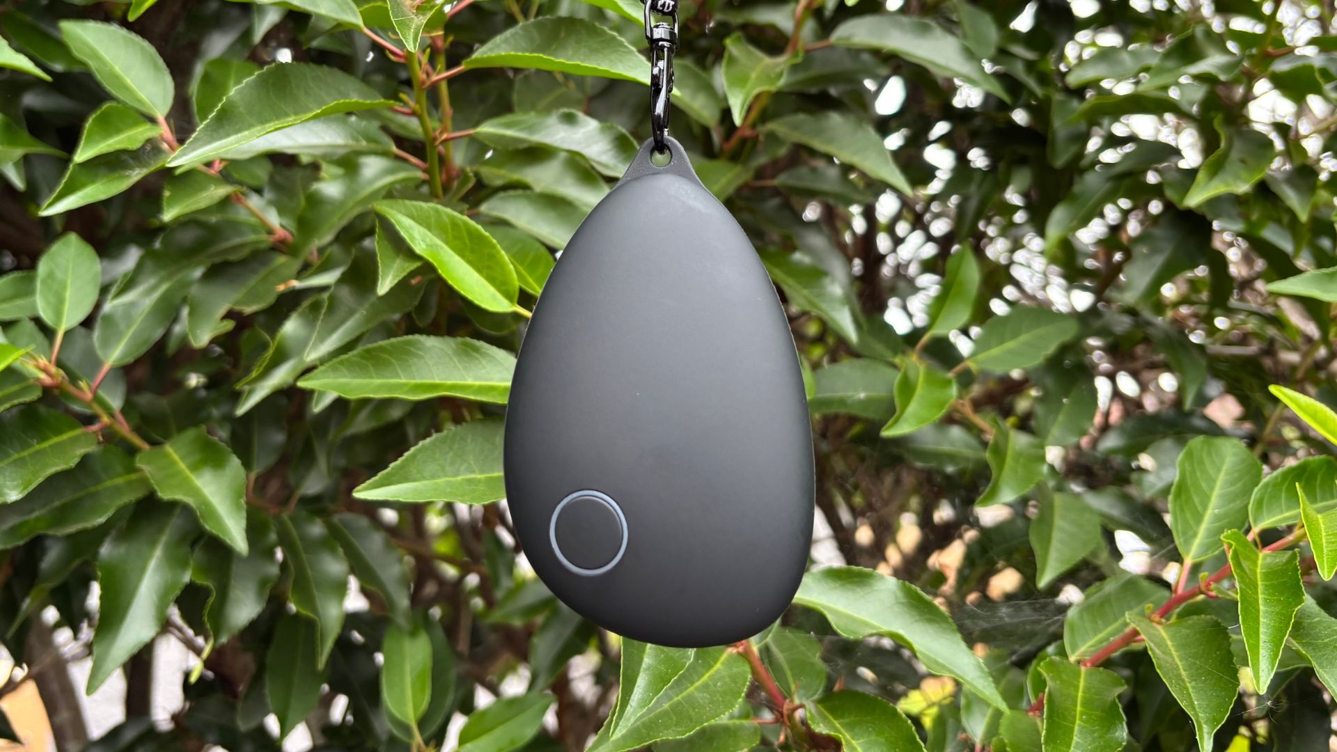 Sensate vagus nerve stimulator against a backdrop of green foliage