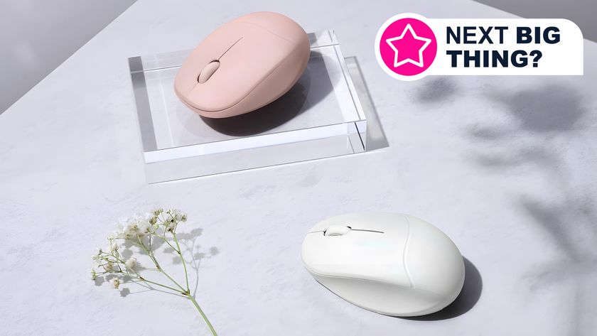 Two examples of the Asus Fragrance Mouse MD101 sitting on a table