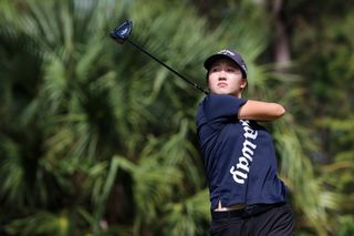 Shuangshuang Fan hits a tee shot with a driver