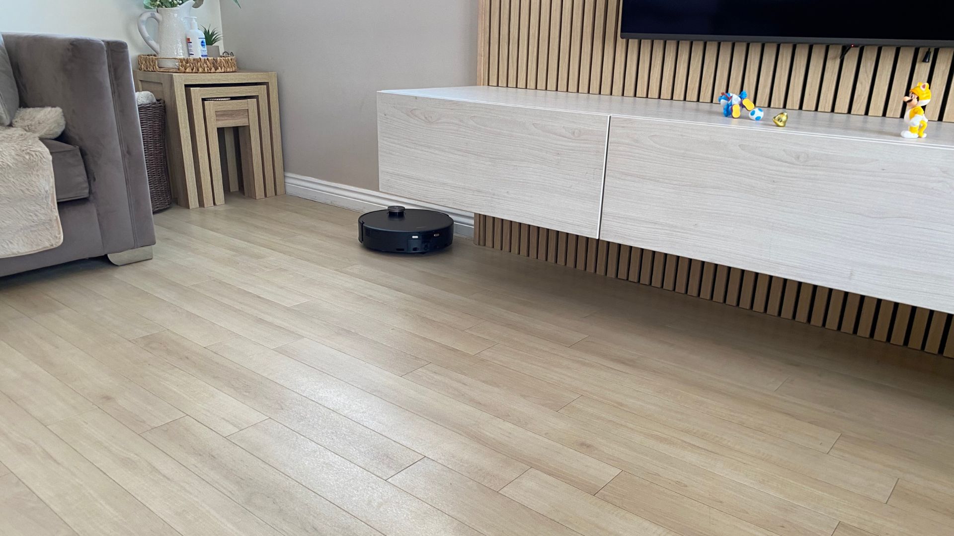 MOVA Z60 Ultra Roller Complete Robot Vacuum working on wooden floors in Carly's home