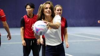 Catherine, Princess of Wales holds a ball at Bisham Abbey National Sports Centre