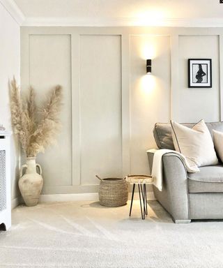 neutral living room with cream carpet and grey sofa