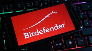 Bitdefender logo on smartphone on top of keyboard