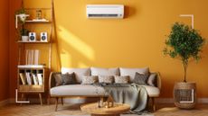 yellow living room with a wall-mounted air conditioning unit to ask is air conditioning worth it in the UK