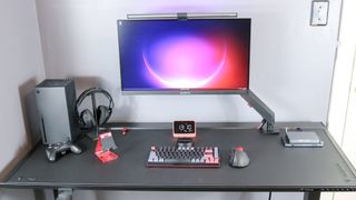 The Khadas Mind mini PC on the Secretlab Magnus Pro standing desk