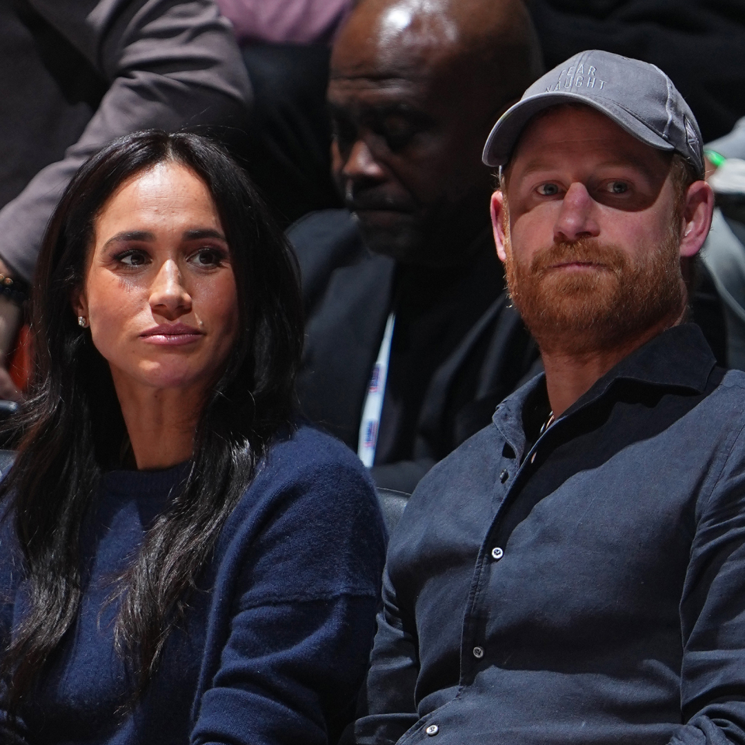 Meghan Markle and Prince Harry match in navy blue outfits while attending an NBA game