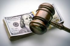 court gavel over a stack of US currency