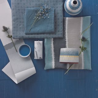 candle with blue shade fabric and bowl