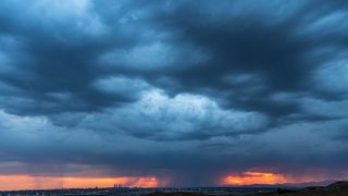  A summer storm is seen near the skyscrapers of the Four Towers Business Area. Rain and hail have reached the city of Madrid during a summer storm, accompanied by high temperatures during a heat wave.