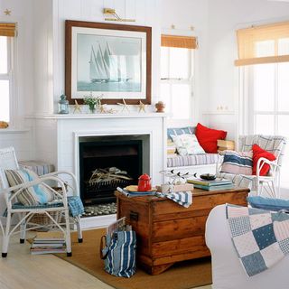 living room with fireplace and wooden trunk