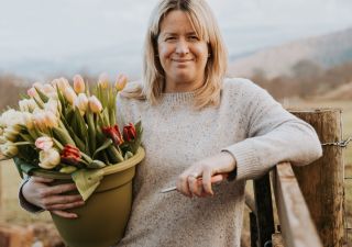 Alison Walker of Yewbarrow Flower Farm holding tulips