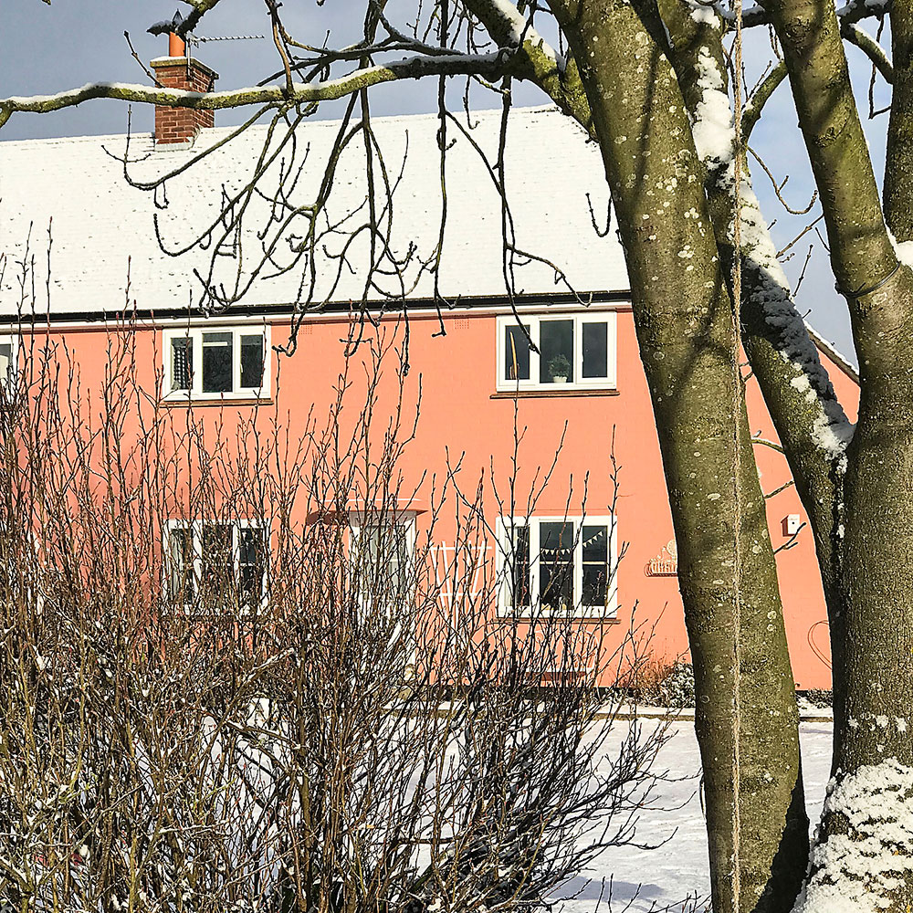 cottage with windows and snow
