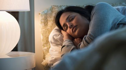 Woman sleeping with light on