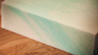A close-up shot of the white and blue cooling gel-foam used in mattresses