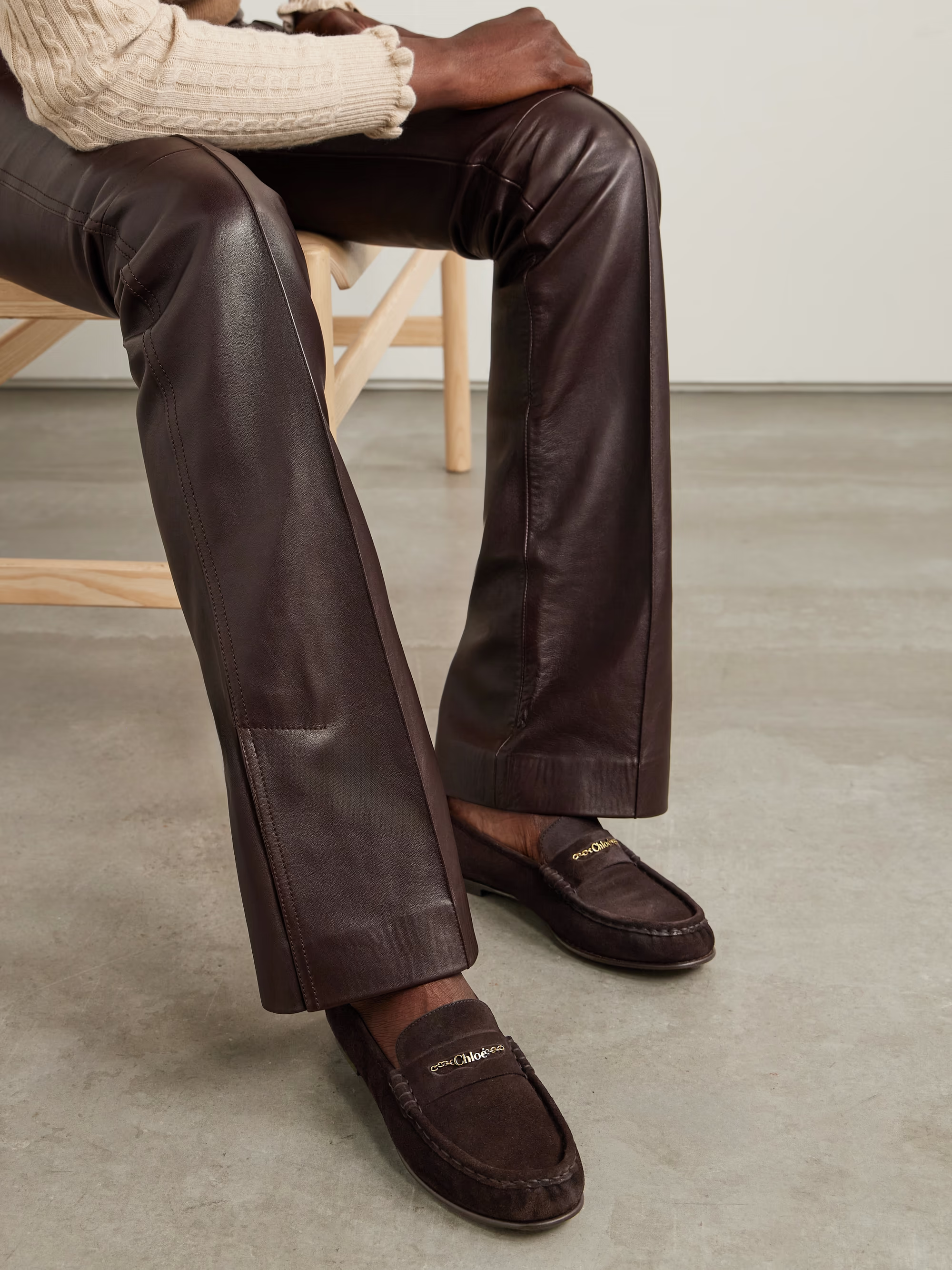 A model wears a pair of Chloé suede loafers