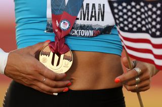 Valarie Allman holds her gold medal on the podium after the Women's Discus Throw Final on day 2 of the 2020 U.S. Olympic Track & Field Team Trials at Hayward Field on June 19, 2021 in Eugene, Oregon.