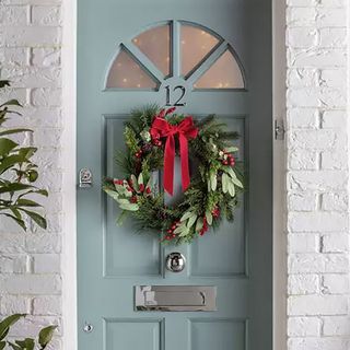Argos Christmas wreath on turqoise door