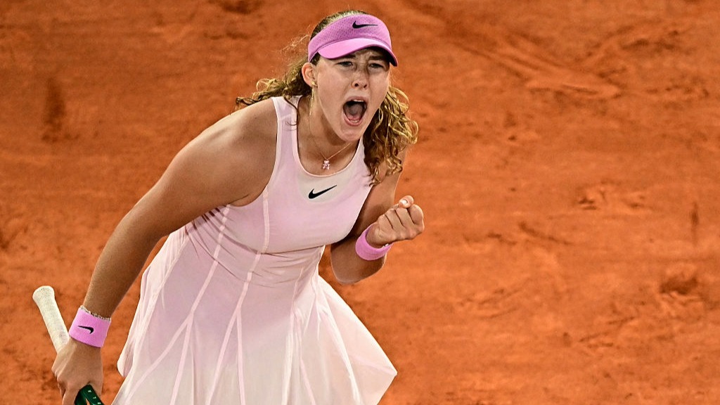 Mirra Andreeva clenches her fist after winning a point at the French Open 2026