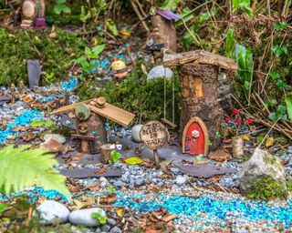 woodland style fairy garden with miniature houses