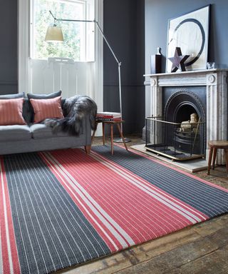 Striped black and red rug in a living room