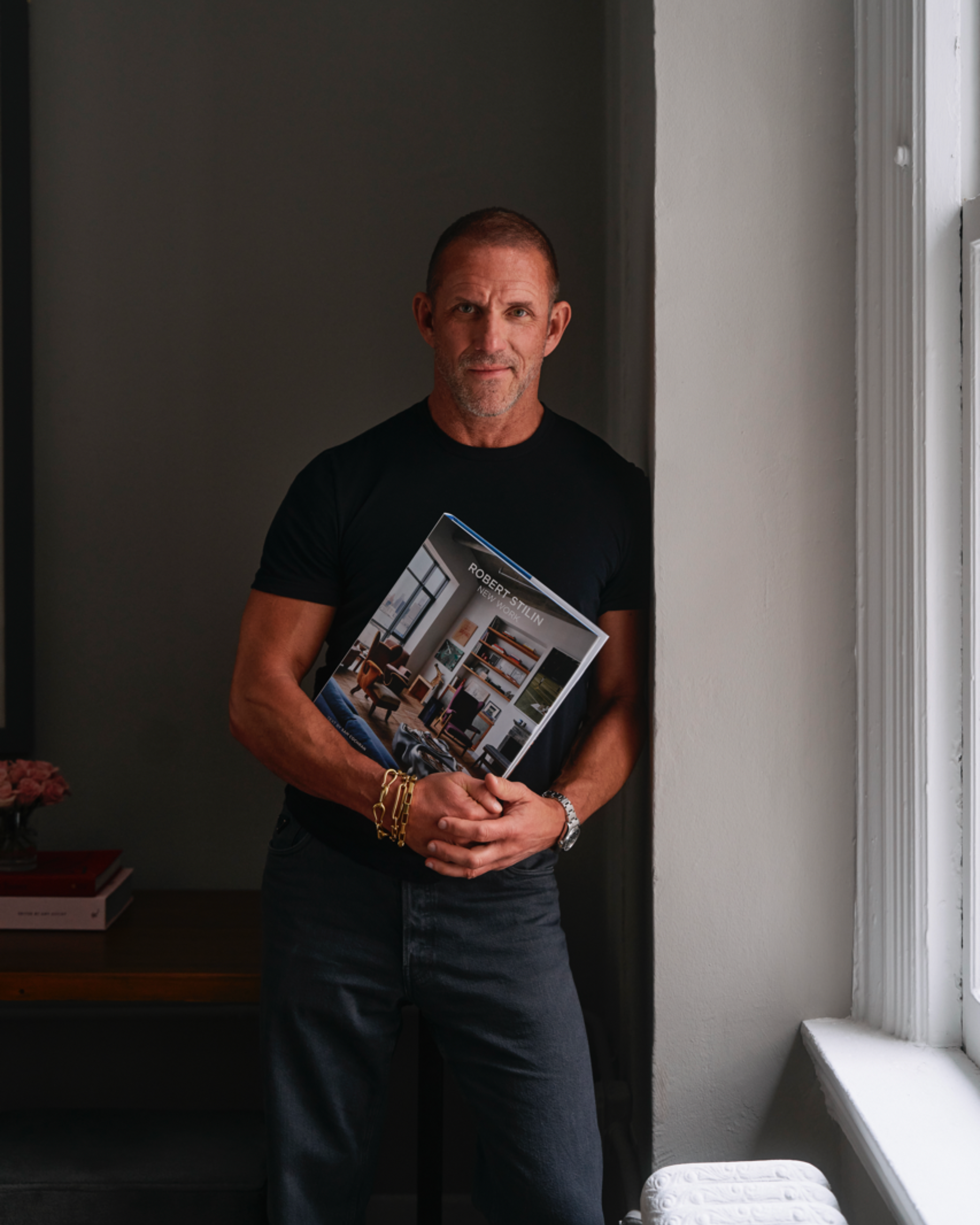 An image of designer Robert Stilin in his NYC furniture shop.