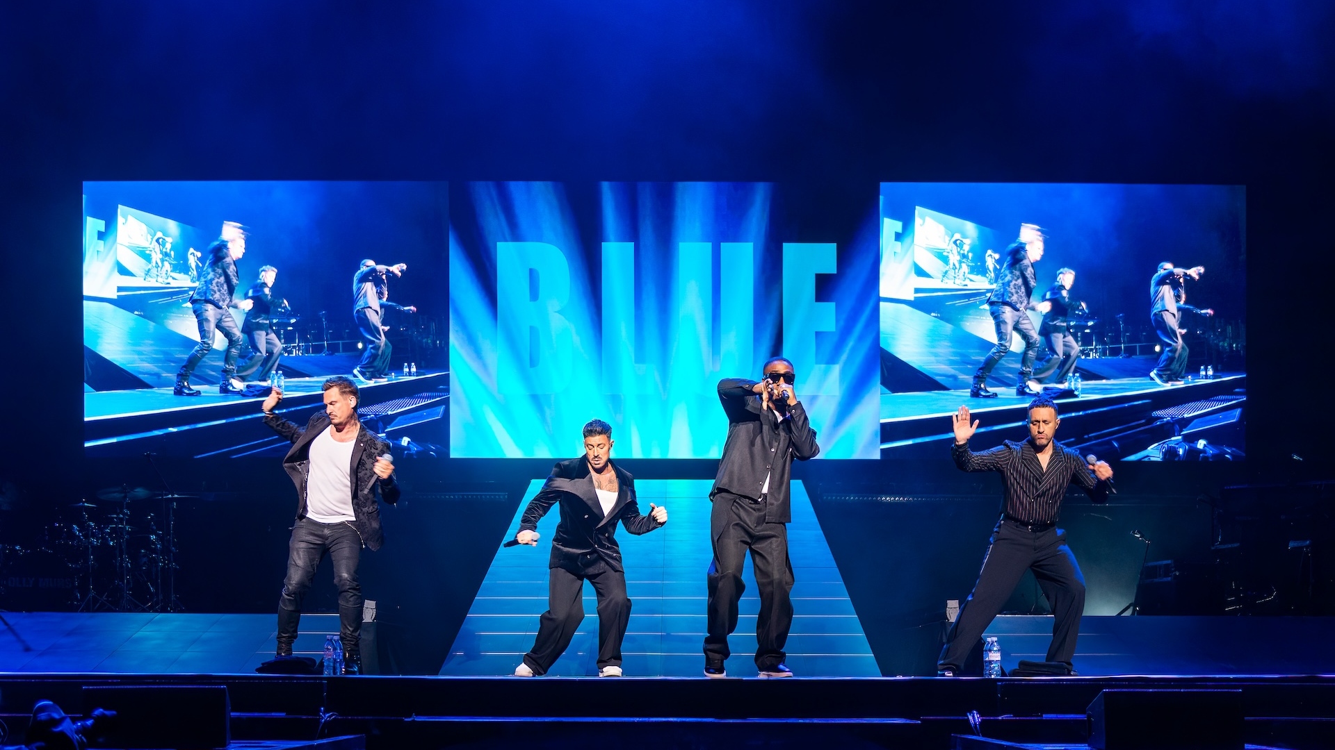 Blue performing on stage at the O2