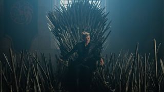 Emma D'Arcy as Rhaenyra Targaryen sitting on the Iron Throne in House of the Dragon season 3