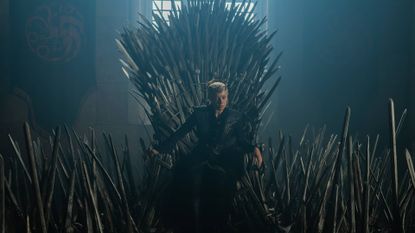 Emma D'Arcy as Rhaenyra Targaryen sitting on the Iron Throne in House of the Dragon season 3