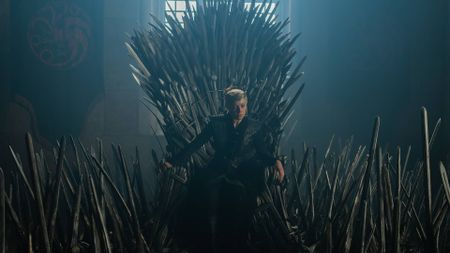 Emma D'Arcy as Rhaenyra Targaryen sitting on the Iron Throne in House of the Dragon season 3