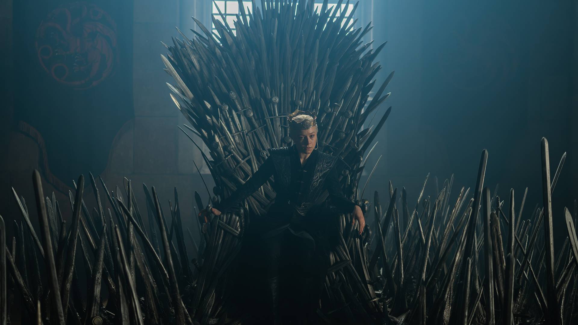 Emma D'Arcy as Rhaenyra Targaryen sitting on the Iron Throne in House of the Dragon season 3