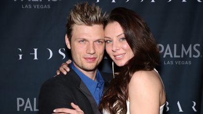 Singer Nick Carter of Backstreet Boys and Lauren Kitt arrive to celebrate their coed bachelor and bachelorette party at Ghostbar at the Palms Casino Resort on February 8, 2014 in Las Vegas