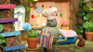 Tiny Chef dusting his home. 