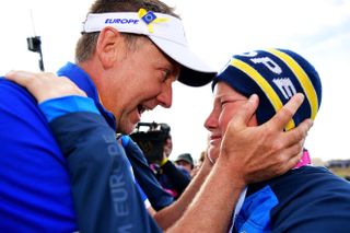 Ian Poulter and his son Luke embrace at the 2018 Ryder Cup