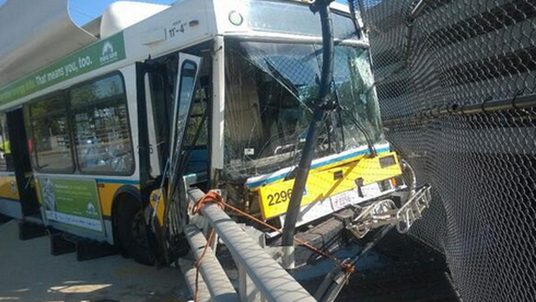 Bus dangles over highway after smashing through guardrail outside Boston