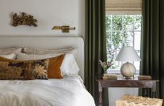 What should you not do in a bedroom layout? white bedroom withh green curtains by Marie Flanigan